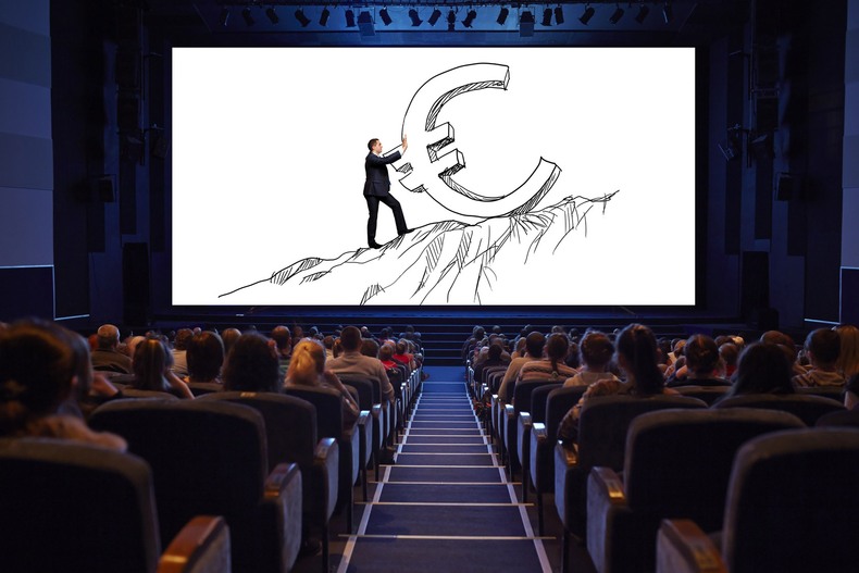 Empty cinema screen with audience.